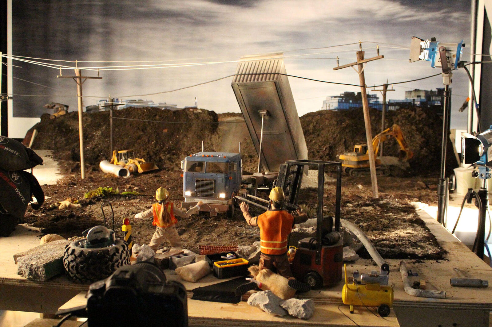 A 1:6 scale miniature construction site built for the Respect the Power film, lit and shot like a live location