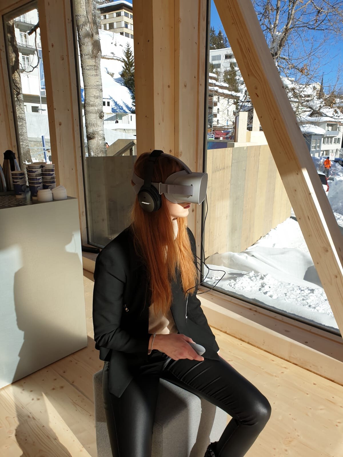 A delegate watching a UNICEF360 film on an Oculus headset in Davos, 2022