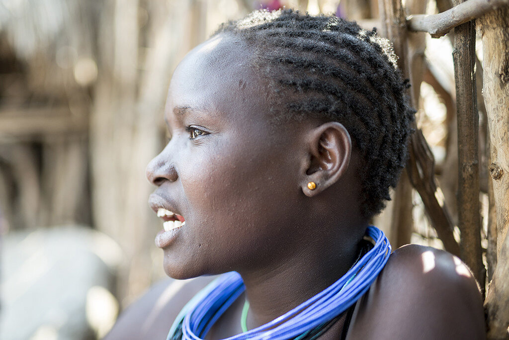Sylvia, one of the two young people at the centre of Karamoja Rising, in her village in northeastern Uganda